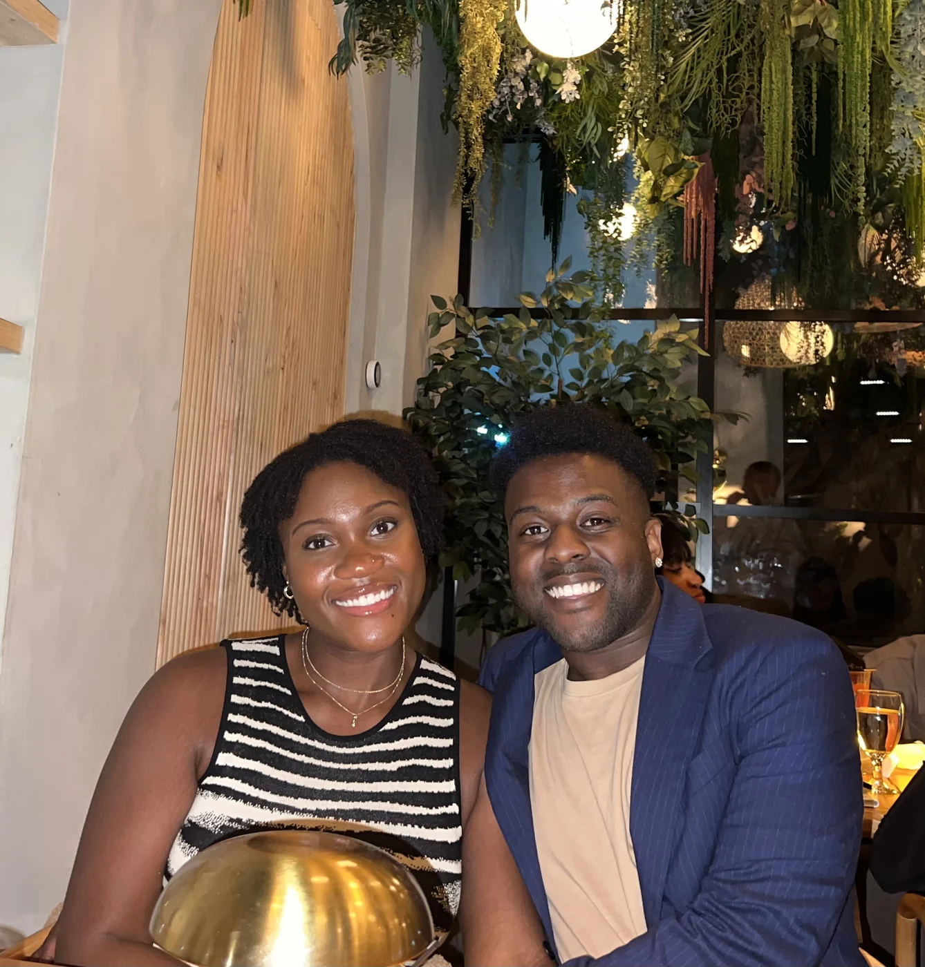 LJ Jackson and a guest smiling at a restaurant