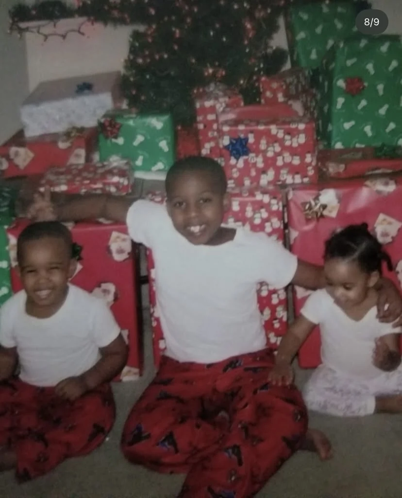 LJ Jackson and two other children on Christmas morning